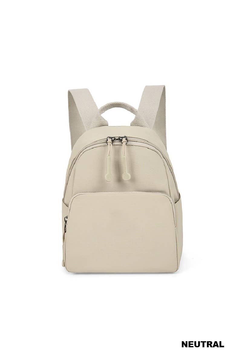 A light beige backpack shown from the front on a white background, with a small 'NEUTRAL' text label in the bottom right corner.