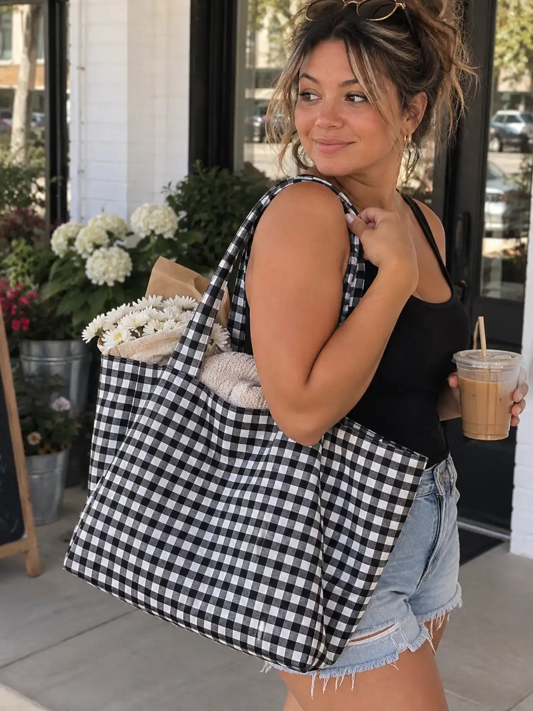 Black and white classic plaid tote bag styled in a natural lifestyle look