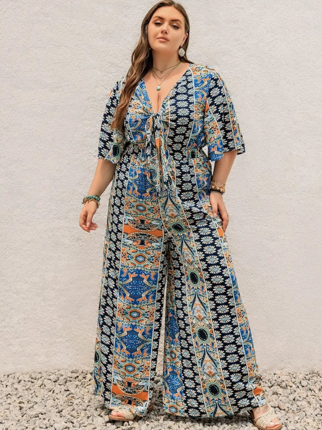 Trendsi Jumpsuits Peacock  Blue / 0XL Plus Size Printed Surplice Long Sleeve Mini Dress