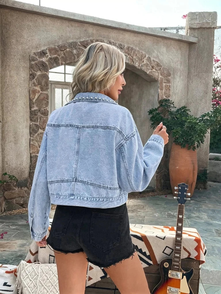Blue studded denim jacket with decorative stud details